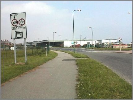 We have re-traced our steps back from Noses Point to the Dock Company roundabout and we are back on the road.  This view is taken from a point just south of the roundabout.The houses to the left of the road sign are in Hill Crescent, Dawdon which can be accessed by turning left off the roundabout as we look at it.