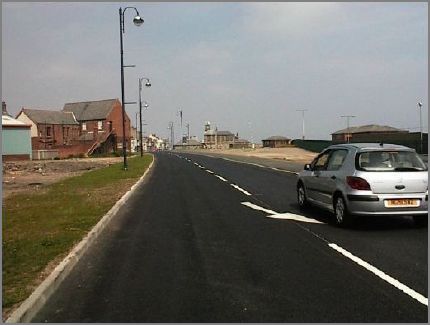 The former Londonderry Office building is clearly seen in the distance. The buildings to the left of the road includes the back of Dow House, the Scouts HQ.