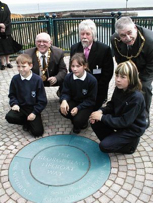 Cllr Alan Fenwick (back right) with Phil Hughes and Cllr Bill Gustard and Ropery Walk School children, pose with the new plaque.